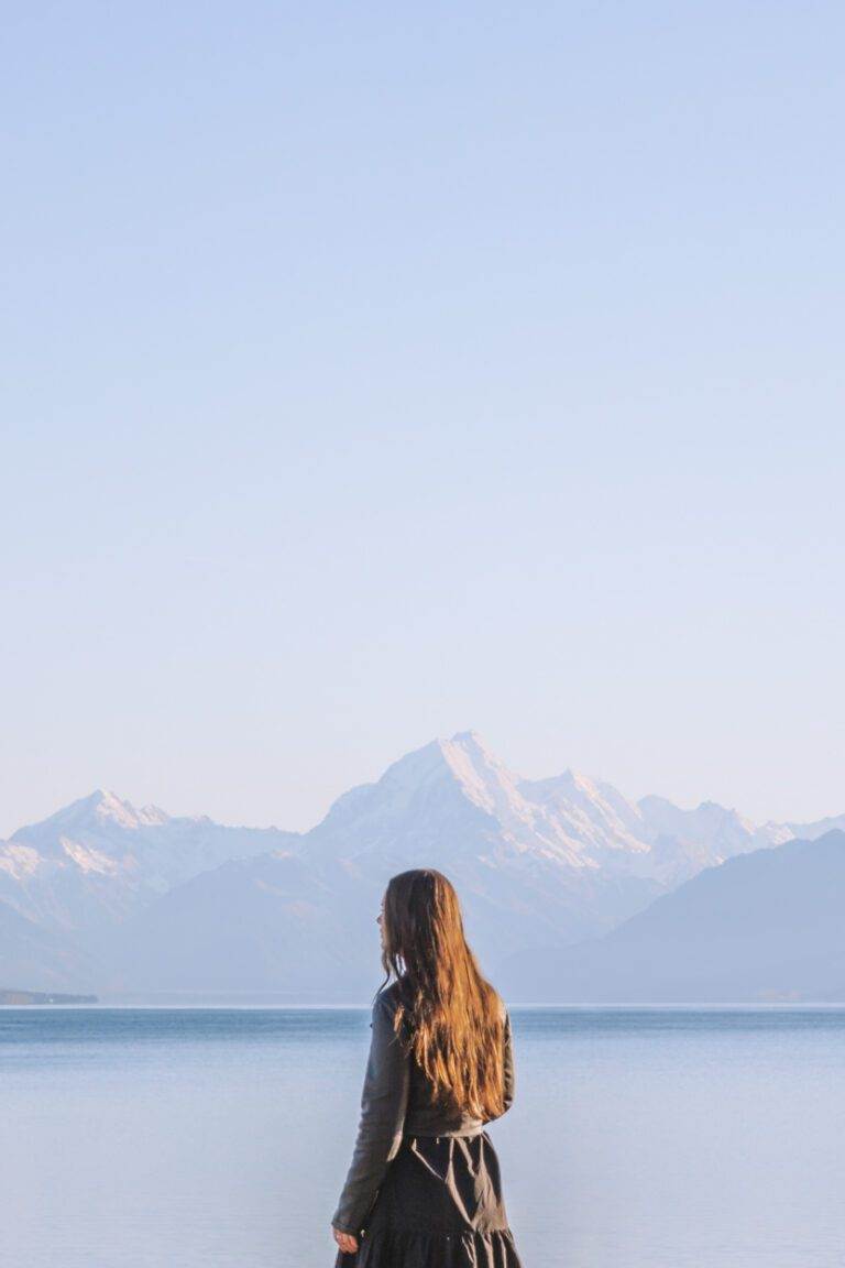 girl standing in front of mount cook