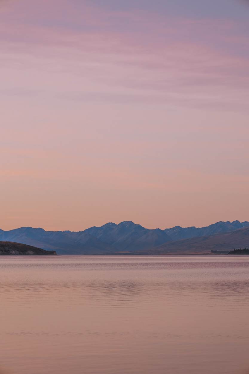 mountains and lake tekapo at dusk