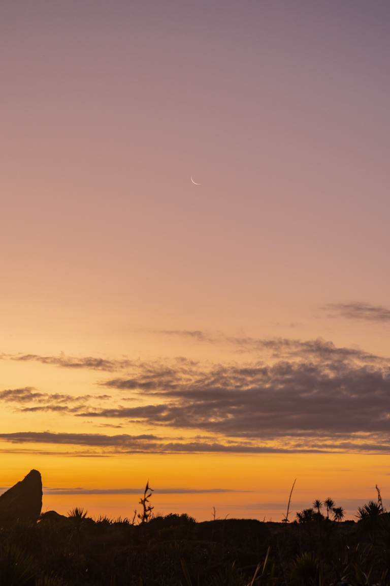 crescent moon at Whatipū Beach