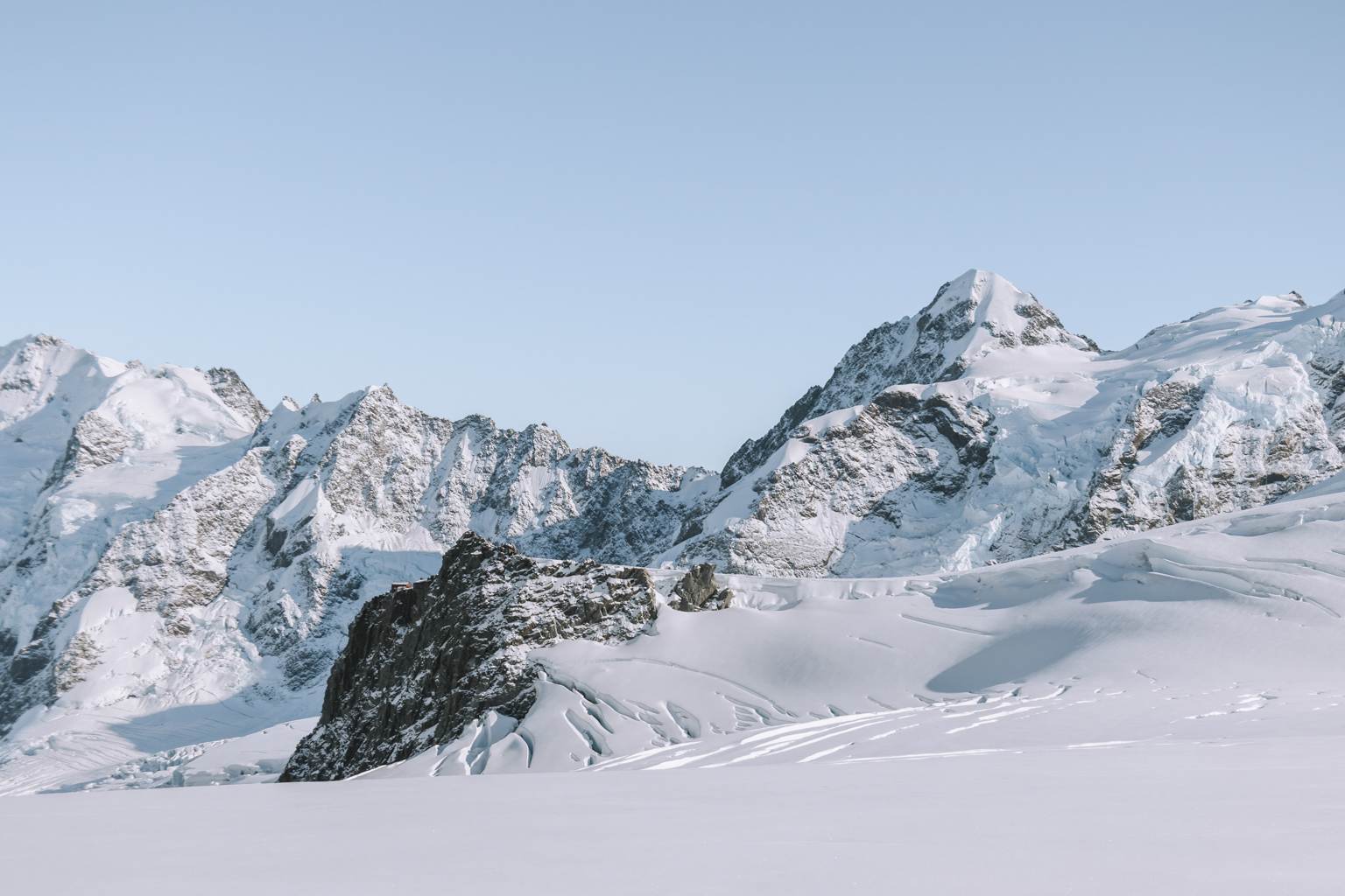 snow covered mountains in autumn in the south island