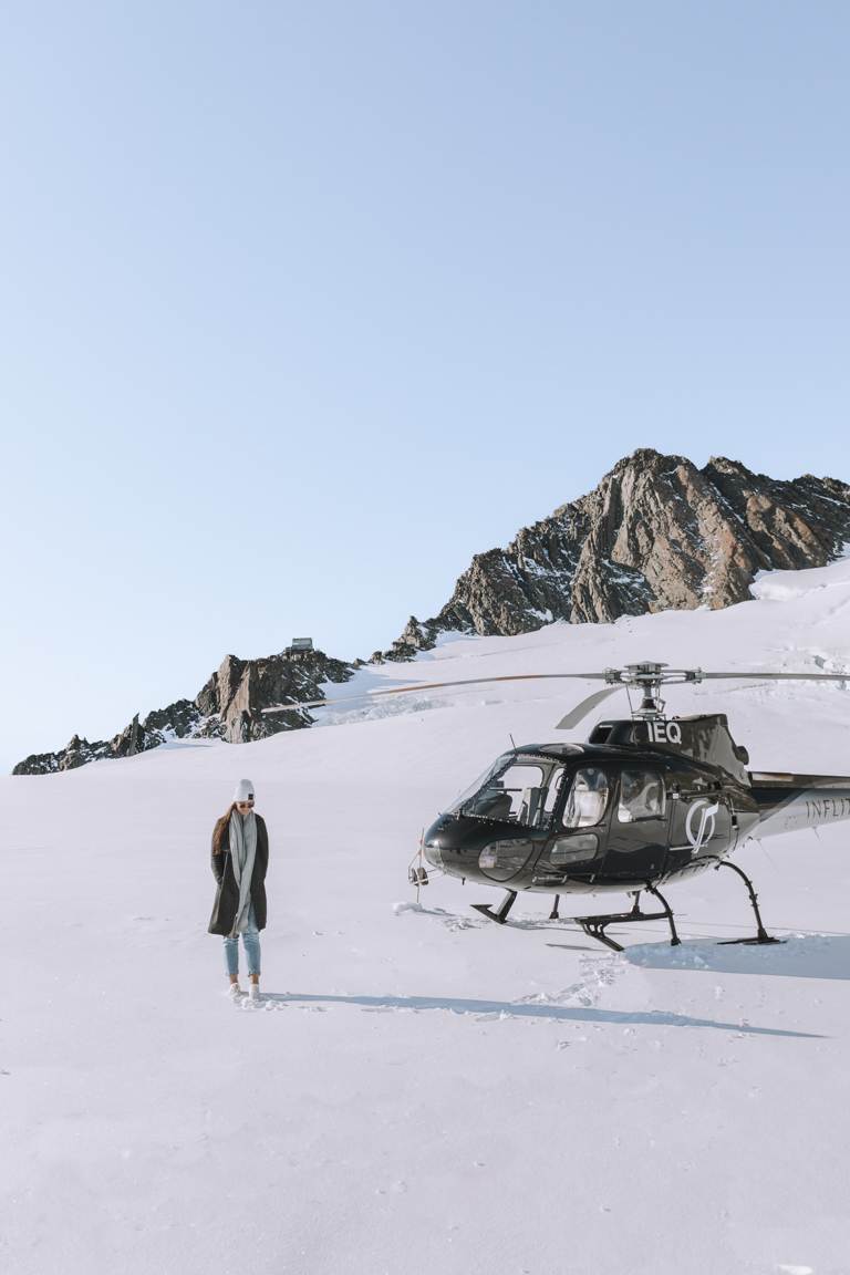 Aoraki/Mount Cook National Park Photos of girl standing next to a heli