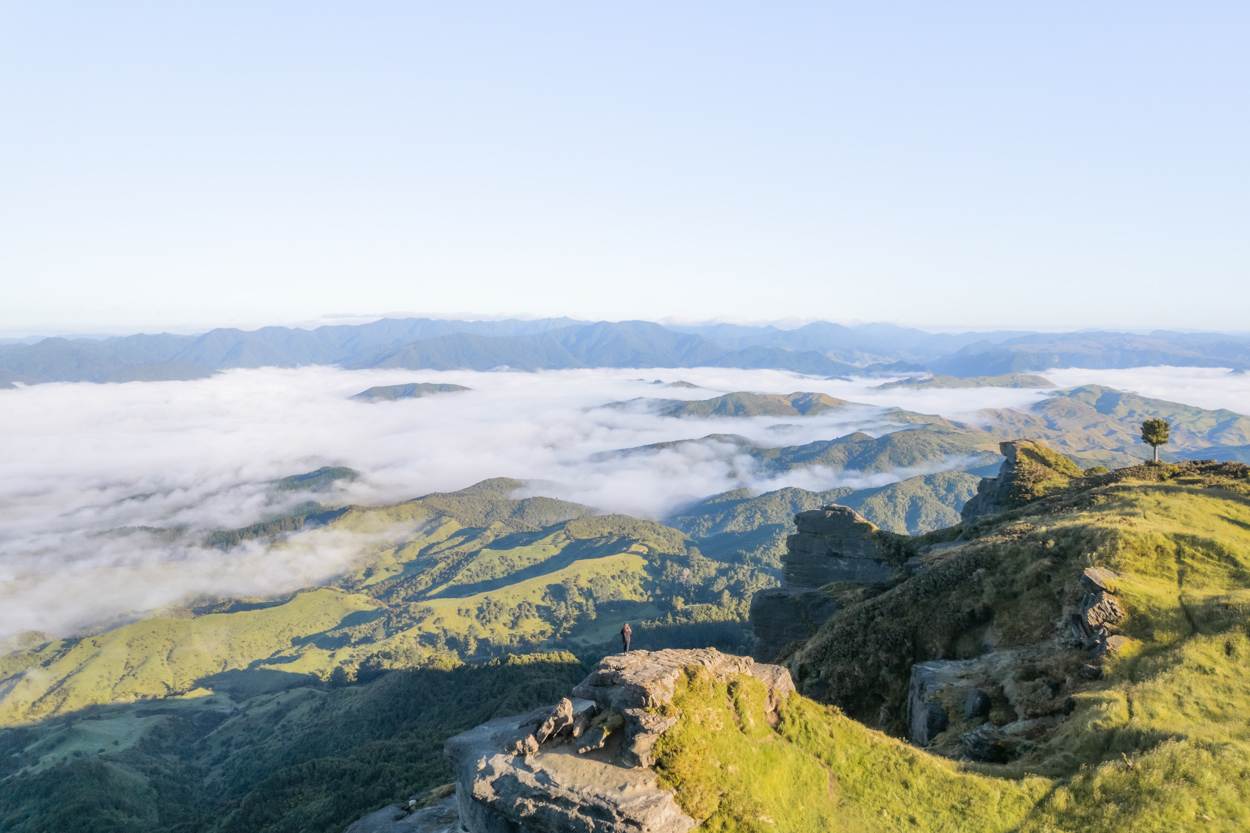 drone view of girl from summit of hiking bell rock