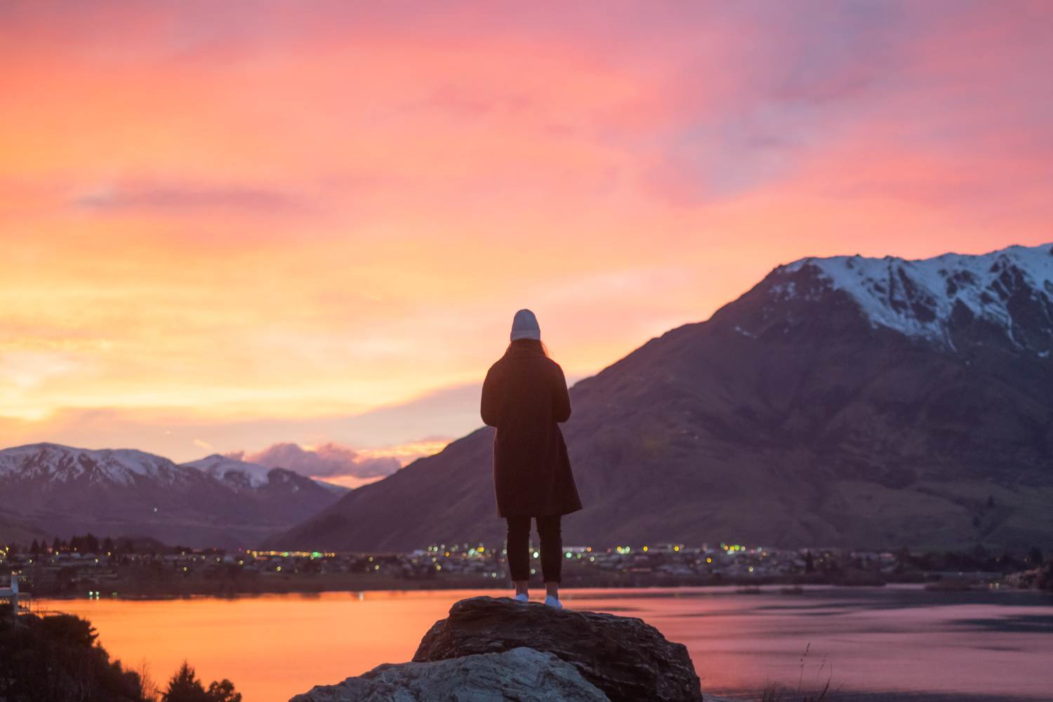 girl standing at sunrise with frankton in background