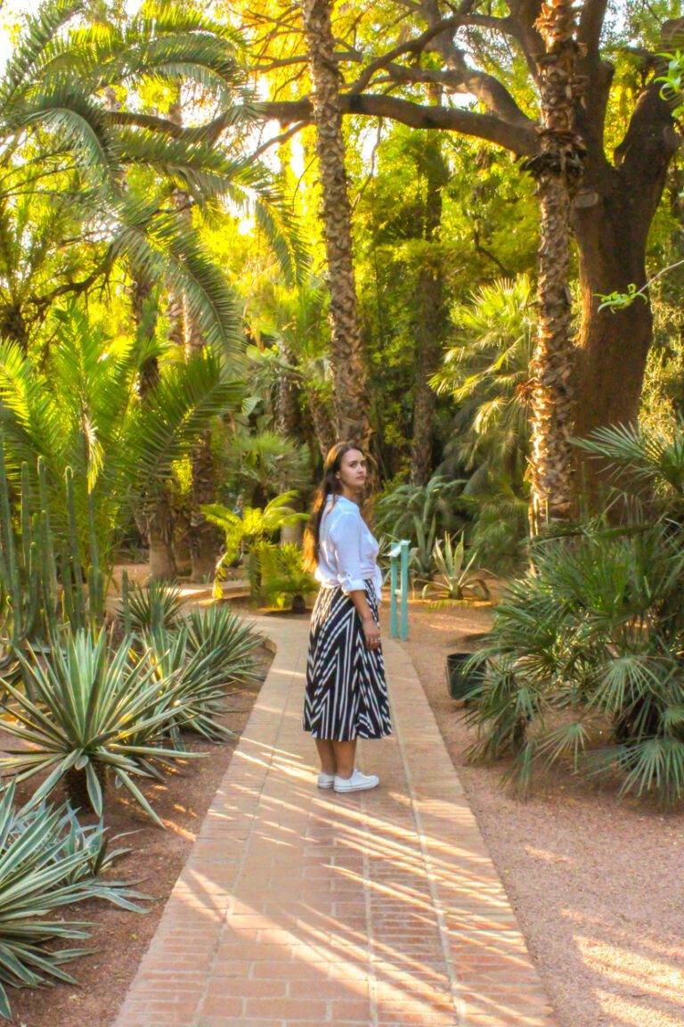 girl standing in ive saint laurent majorelle gardens