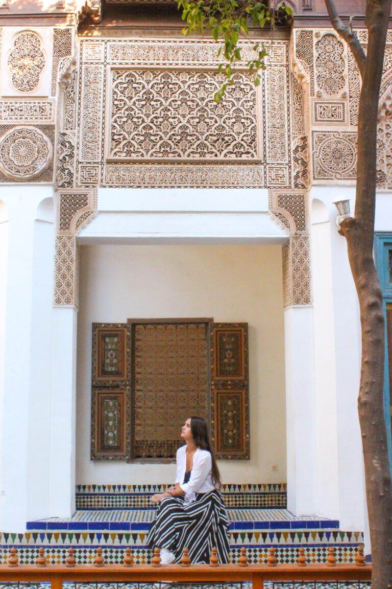 girl sitting at palais de la bahia