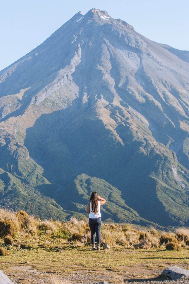 girl standing in front of mount taranaki