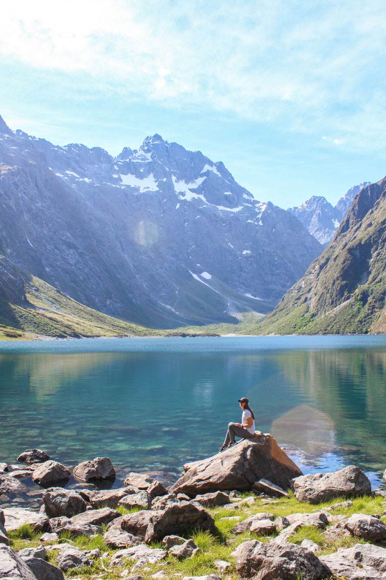 woman at lake marian waters edge