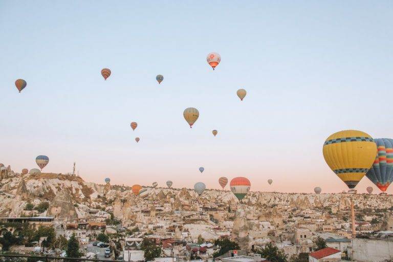 sunrise at artemis caves overlooking balloons at sunrise