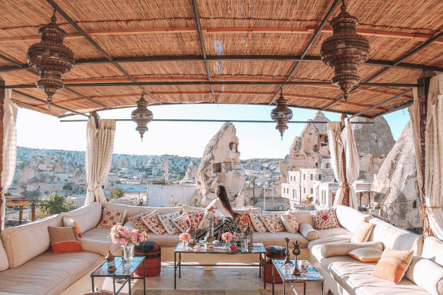 girl sitting at artemis cave suite balcony