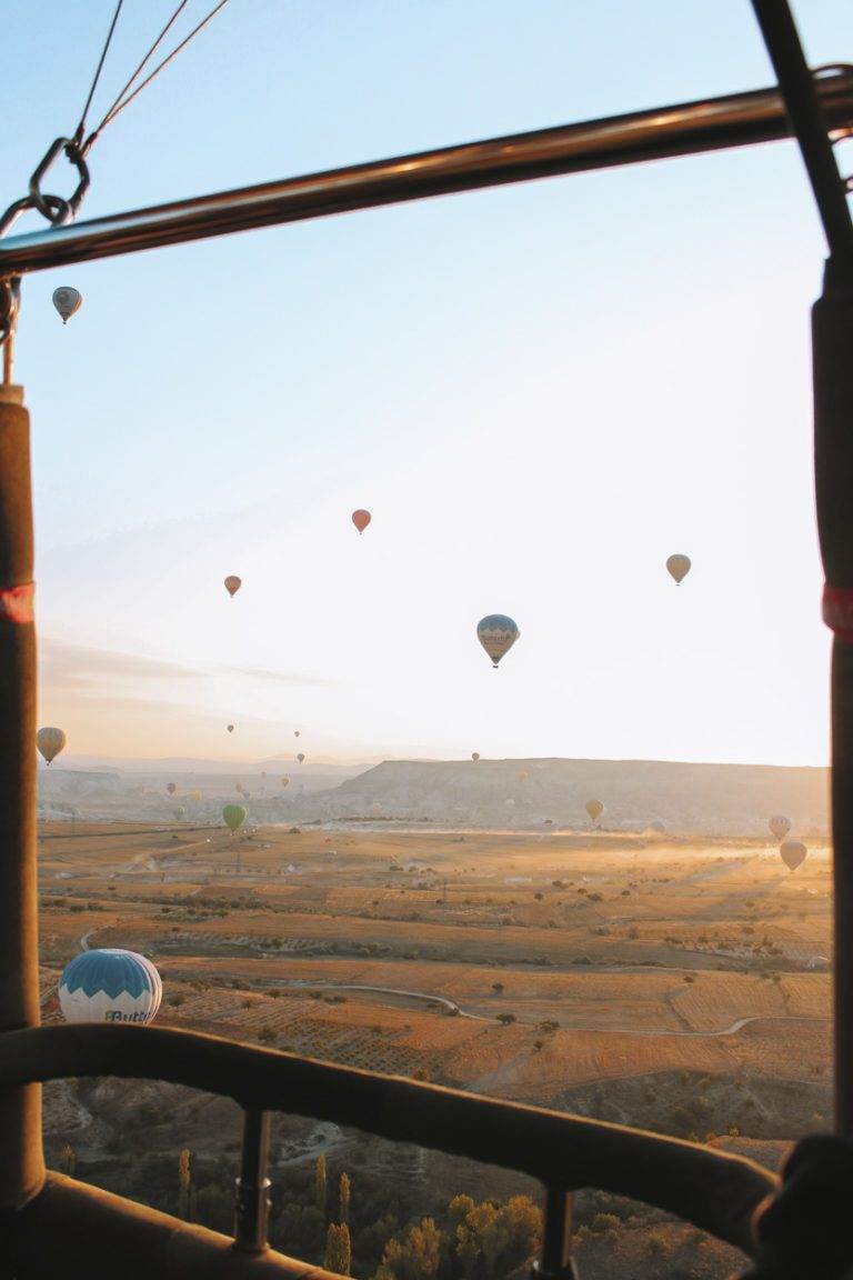 view of cappadocia at sunrise from hot air balloon