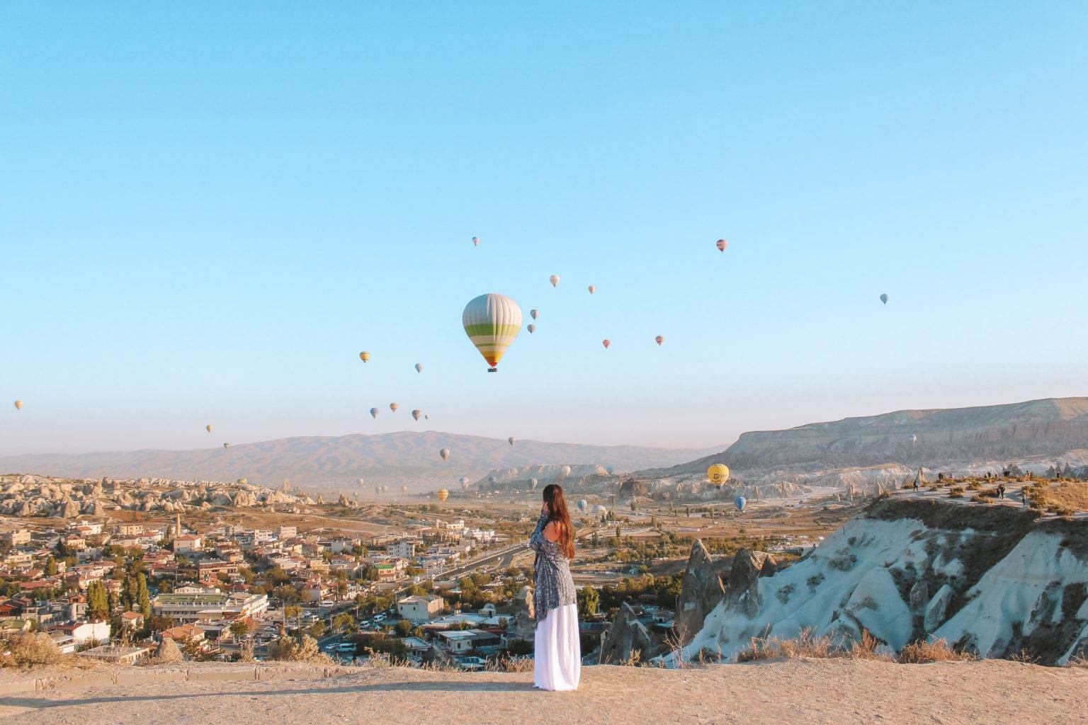 girl standing looking at view of lovers hill cappadocia