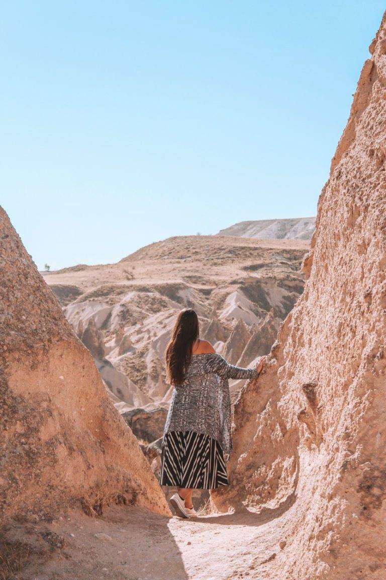 girl looking out over cappadocia landscape