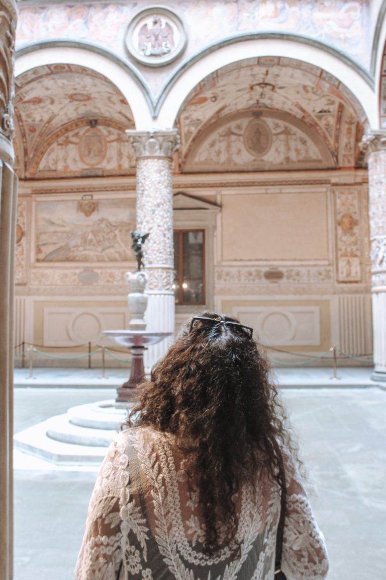 woman standing in palazzo vecchio, florence