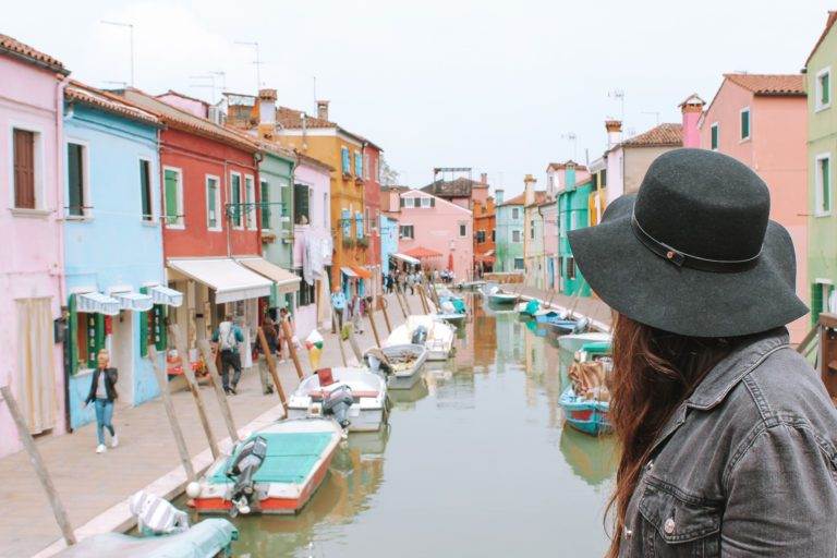 girl overlooking burano colourful town