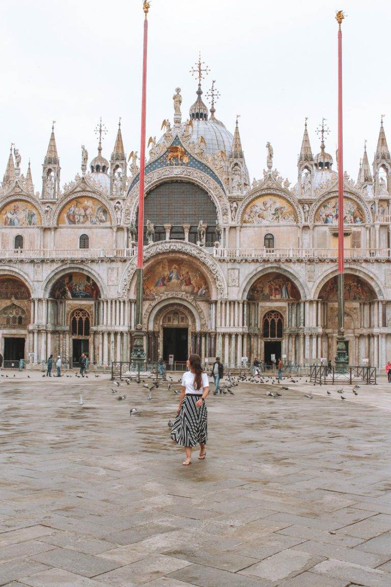 girl walking in piazza san marco saint-marks basilica