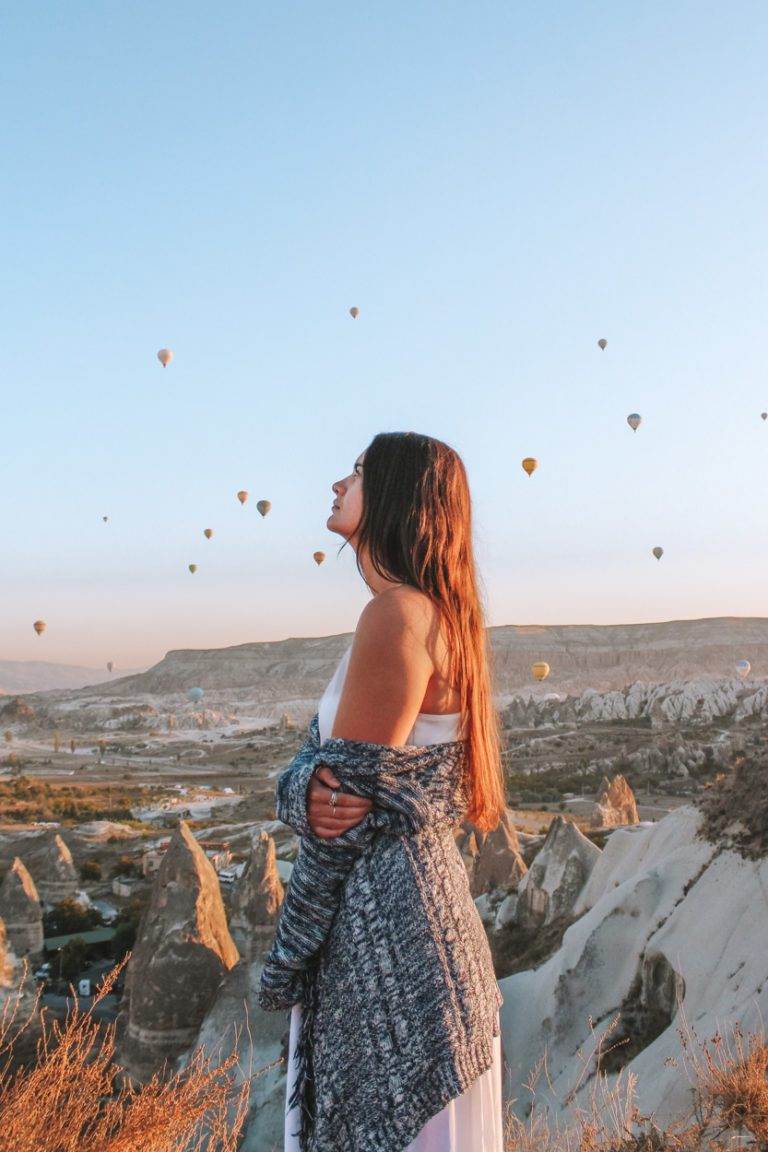 girl standing on top of lovers hill in cappadocia