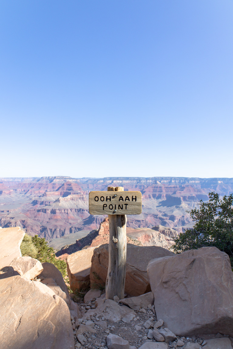 photograph ooh aah point sign grand caynon backdrop